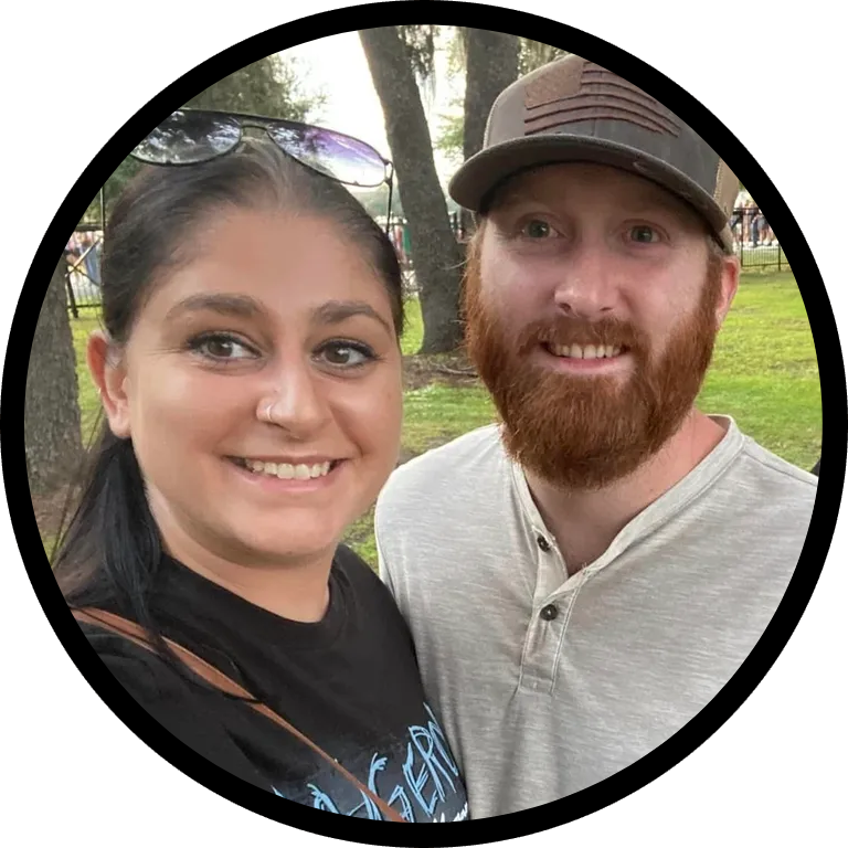 A man and woman standing next to each other.